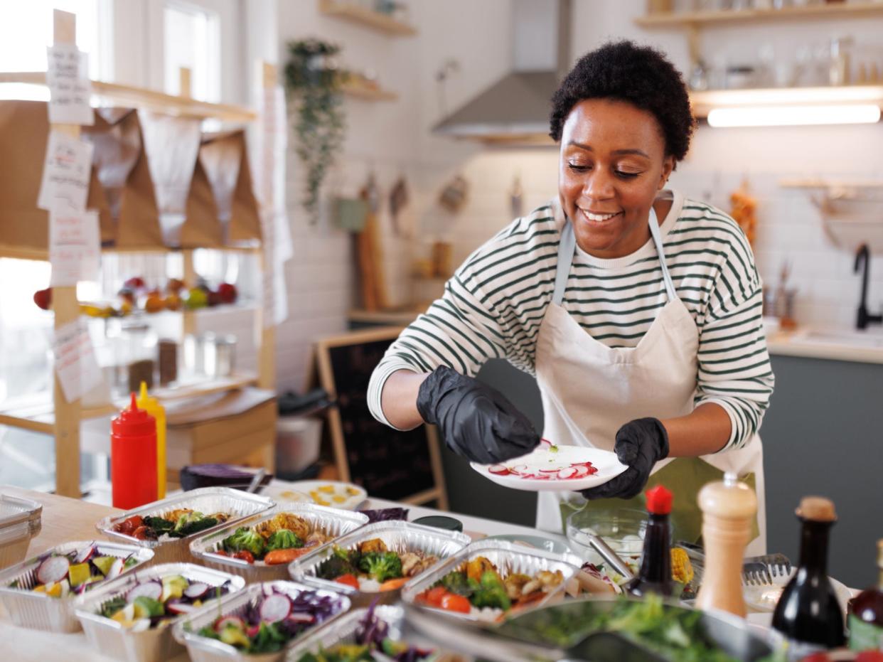 Chef packing food into containers