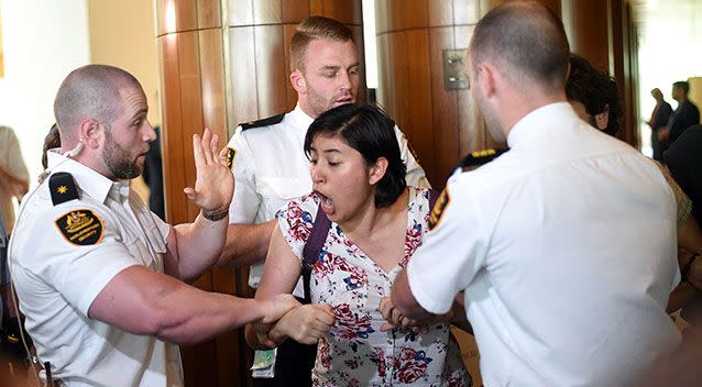 A protester was dragged screaming from the chamber. Source: AAP