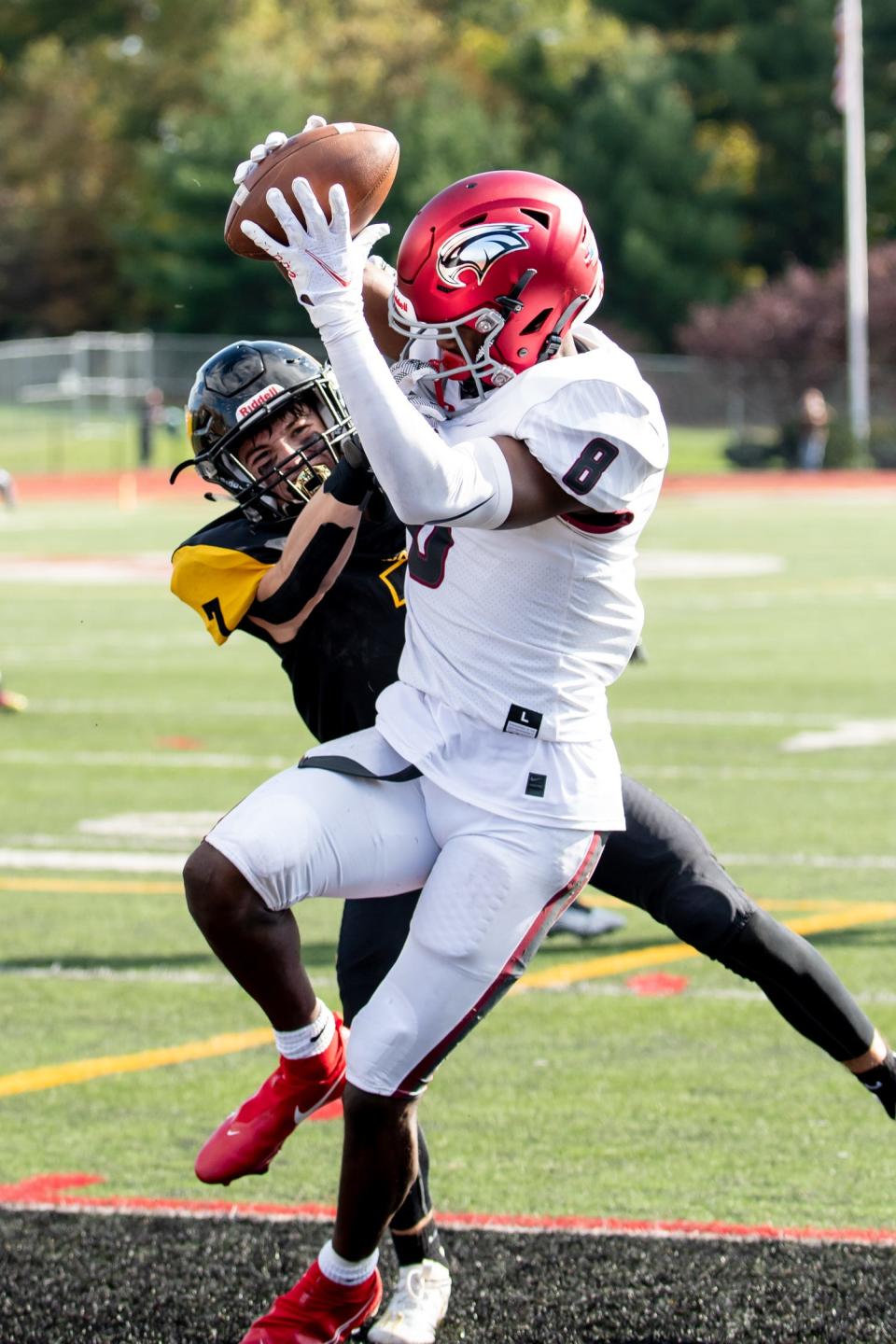 St. Joseph's Prep wide receiver Marvin Harrison, Jr. catches the ball in the end zone for a touchdown while Archbishop Wood defensive back Andrew McHugh defends on Saturday, October 31, 2020.  Prep won, 52-6.