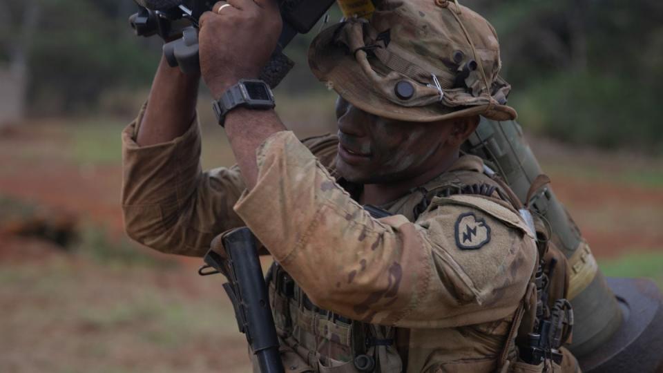 A soldier assigned to 2nd Battalion, 27th Infantry Regiment, 3rd Infantry Brigade Combat Team, 25th Infantry Division, adjust his FGM-148 Javelin onto his shoulder at South Range on Schofield Barracks, Hawaii, Nov. 6, 2023. (Sgt. Michael Martin/Army)