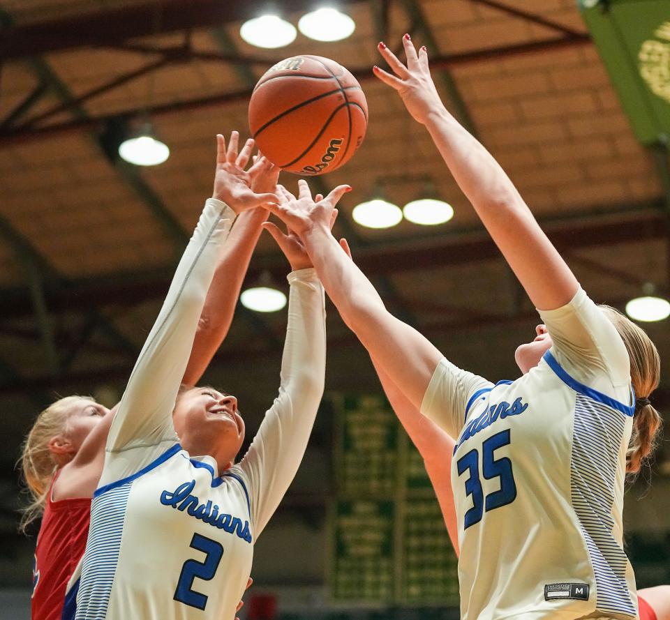 Lake Central's guard Riley Milausnic (2) reaches for a rebound with Lake Central's forward Ayla Krygier (35) on Thursday, Oct. 5, 2023, during the Hall of Fame Classic girls basketball tournament at New Castle Fieldhouse in New Castle. Lake Central defeated Indian Creek, 51-45.