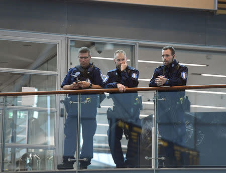 Armed Finnish policemen on guard at the Helsinki airport, after stabbings in Turku, in Vantaa, Finland August 18, 2017. LEHTIKUVA/Vesa Moilanen via REUTERS ATTENTION EDITORS - THIS IMAGE WAS PROVIDED BY A THIRD PARTY. NOT FOR SALE FOR MARKETING OR ADVERTISING CAMPAIGNS. NO THIRD PARTY SALES. NOT FOR USE BY REUTERS THIRD PARTY DISTRIBUTORS. FINLAND OUT. NO COMMERCIAL OR EDITORIAL SALES IN FINLAND.