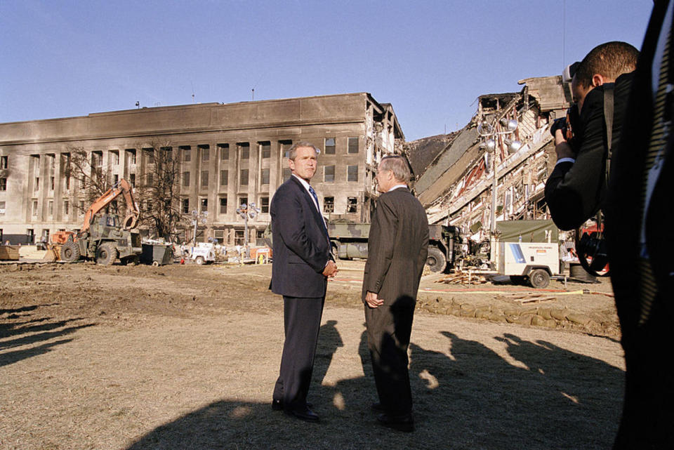 <p>Photo by David Hume Kennerly/Getty Images</p><p> President George W. Bush and Secretary of Defense Donald Rumsfeld survey the damage at the Pentagon building on September 12, 2001.</p>