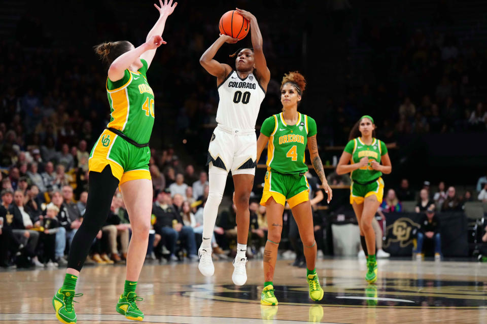 Colorado Buffaloes guard Jaylyn Sherrod (00) shoots the ball over Oregon Ducks forward Grace VanSlooten (40) in the first quarter at CU Events Center Feb. 9, 2024, in Boulder, Colorado.