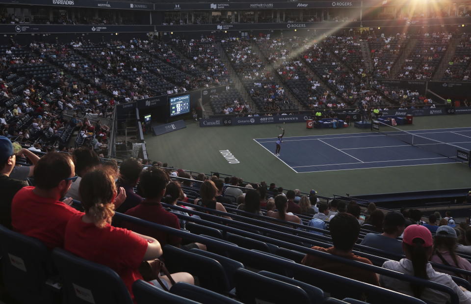 Sloane Stephens, left, of the United States, returns a ball to Sofia Kenin, also of the United States, during women's match action at the National Bank Open tennis tournament in Toronto, Monday, Aug. 8, 2022. (Cole Burston/The Canadian Press via AP)