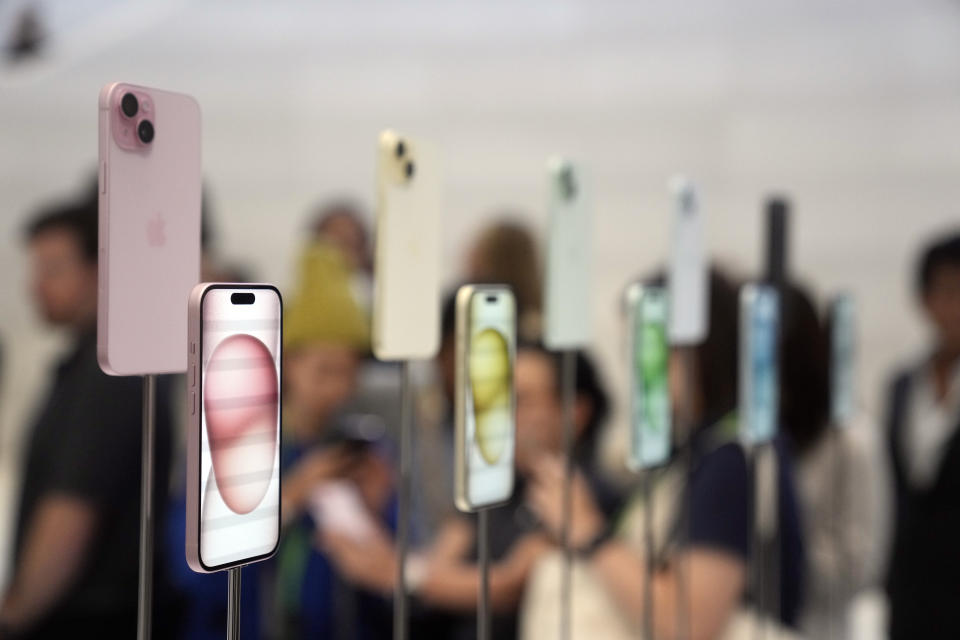 iPhone 15 and 15 Plus models are displayed during an announcement of new products on the Apple campus Tuesday, Sept. 12, 2023, in Cupertino, Calif. (AP Photo/Jeff Chiu)