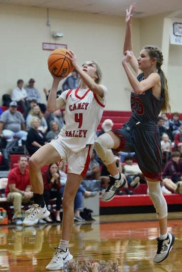 Caney Valley High's Jade Upton, No. 4, elevates toward the backboard during girls basketball play on Nov. 29, 2022, against Barnsdall High, in Ramona.