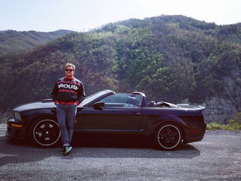 Fabrizio happily with his Mustang in Italy.