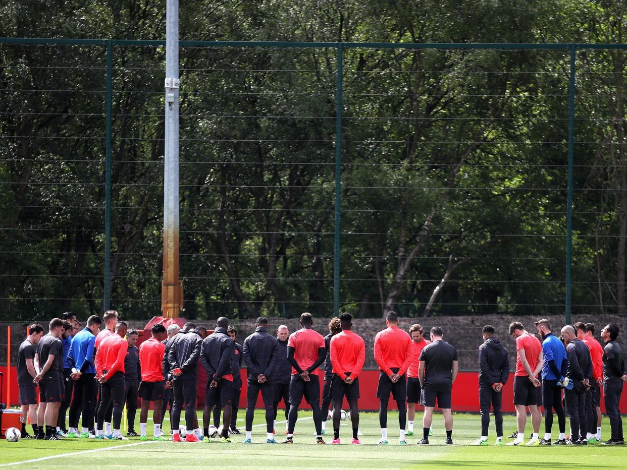 United's players held a minute's silence for the victims of the Manchester attack: Getty