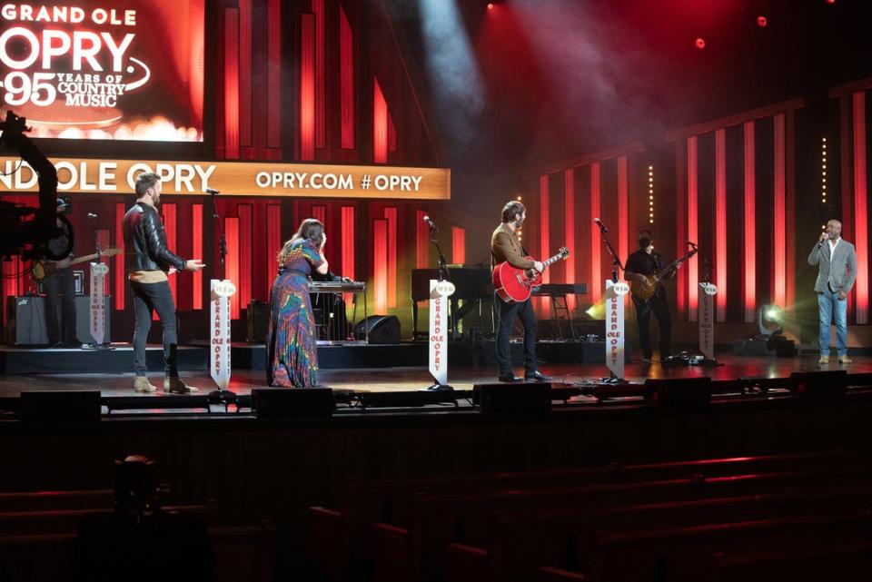 Lady A members Charles Kelley, Hillary Scott and Dave Haywood respond to their Grand Ole Opry membership invitation by Opry member Darius Rucker on Jan. 21. The segment was recorded during taping for the NBC special "Grand Ole Opry: 95 Years of Country Music" to air Feb. 14.