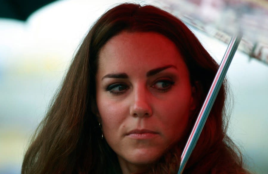 FILE – Britain’s Kate, the Duchess of Cambridge, looks back during the opening ceremony of the renovated Commonwealth Street in central Honiara, Solomon Islands, Monday, Sept. 17, 2012. (AP Photo/Daniel Munoz, Pool, File)