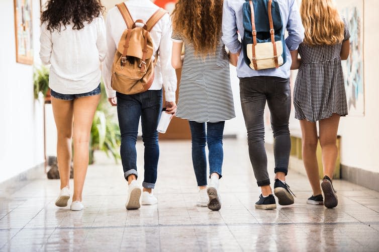 <span class="caption">Morality can be influenced by peers.</span> <span class="attribution"><a class="link " href="https://www.shutterstock.com/image-photo/unrecognizable-teenage-students-high-school-hall-695954590" rel="nofollow noopener" target="_blank" data-ylk="slk:Halfpoint/Shutterstock;elm:context_link;itc:0;sec:content-canvas">Halfpoint/Shutterstock</a></span>