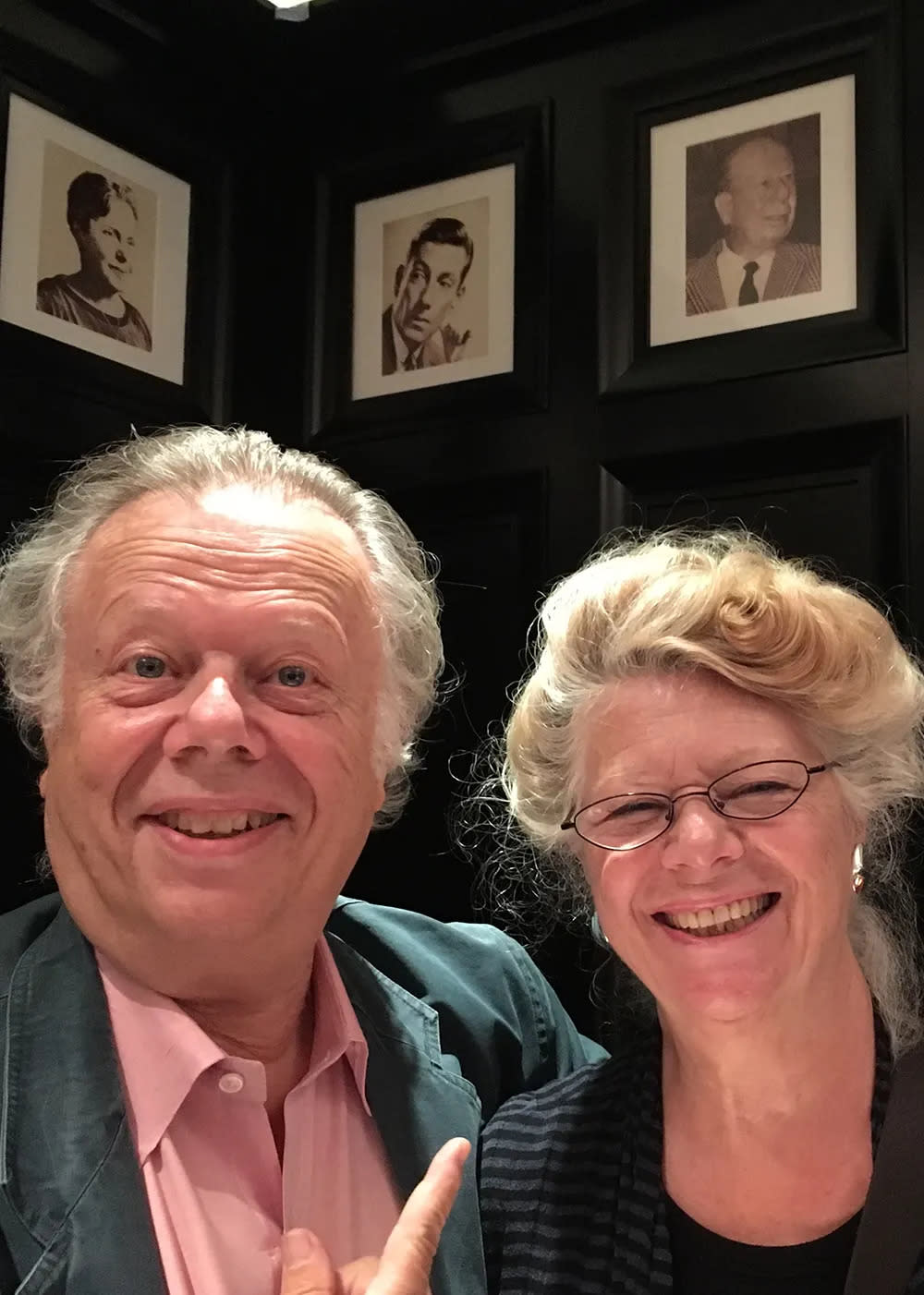 John and Jane Lahr smiling overlooking their fathers portrait.