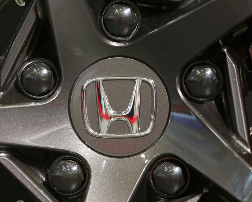 FILE - In this Oct. 31, 2016, file photo, the logo of Honda Motor Co. is seen on a tire wheel of a Honda car at the Japanese automaker's headquarters in Tokyo. Honda Motor Co. is recalling 772,000 additional Honda and Acura vehicles in the U.S. for defective front passenger seat air bag inflators made by Japanese supplier Takata Corp. The vehicles, announced in a recall late Tuesday, Jan. 10, 2017 by Honda in the U.S., are part of an expanded recall of 1.29 million vehicles, including those affected by earlier recalls. (AP Photo/Shizuo Kambayashi, File)