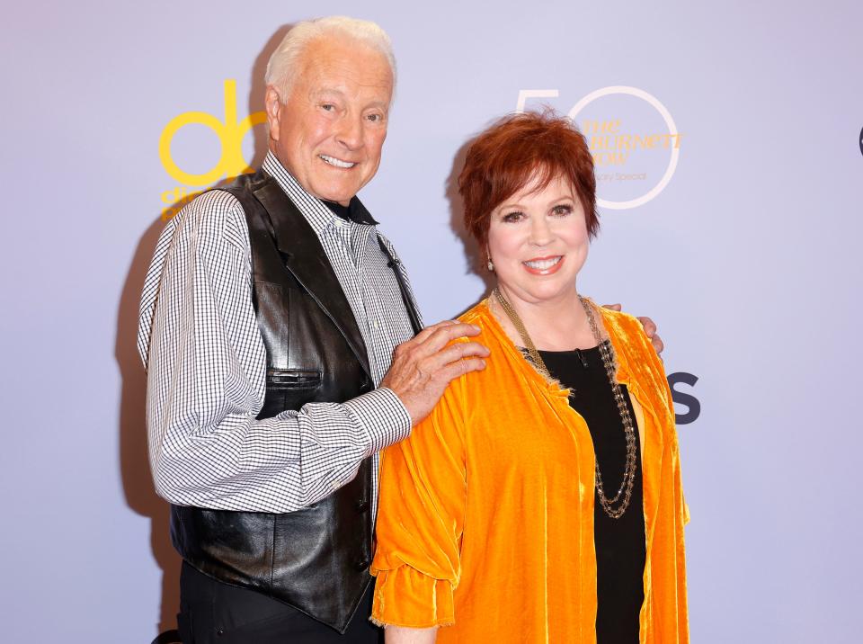 Lyle Waggoner, left, and Vicki Lawrence, two cast members of "The Carol Burnett Show," arrive for a 50th anniversary "Burnett" special in 2017. Waggoner died Tuesday at the age of 84.