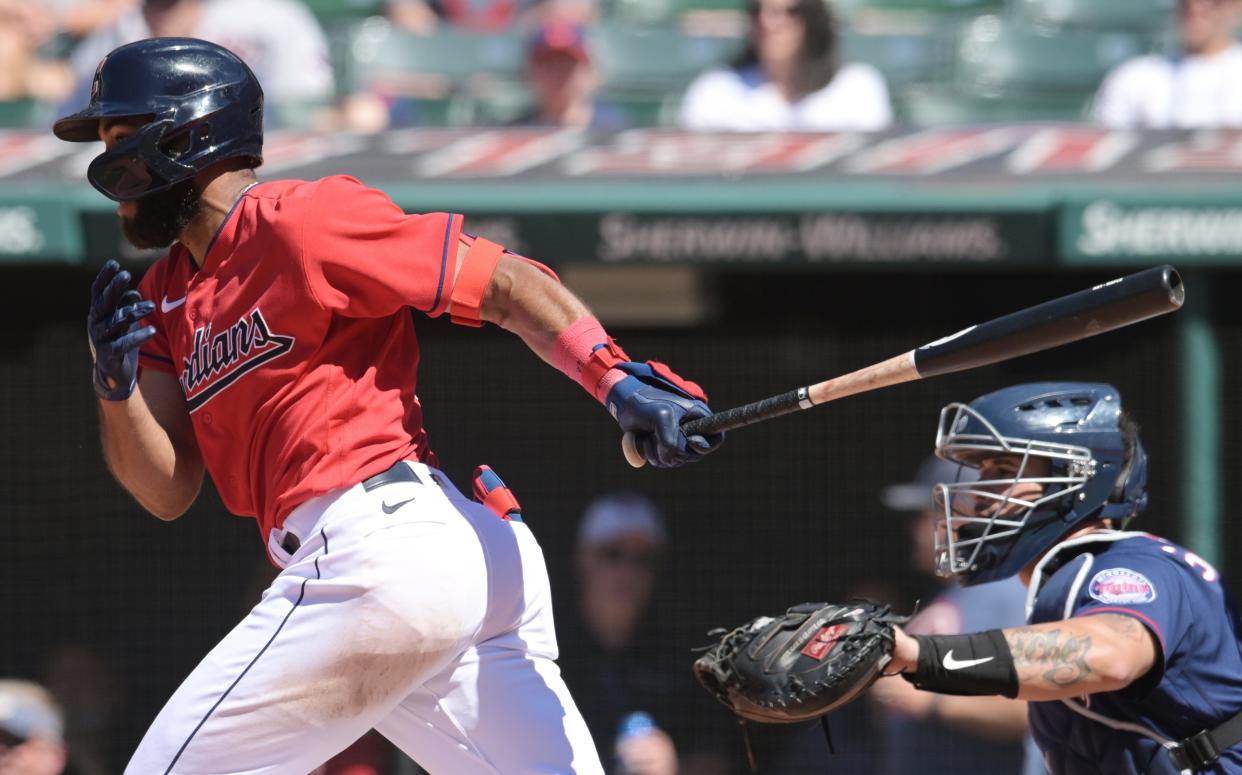 Guardians shortstop Amed Rosario hits a two-run single during the eighth inning against the Minnesota Twins, June 28, 2022, in Cleveland.