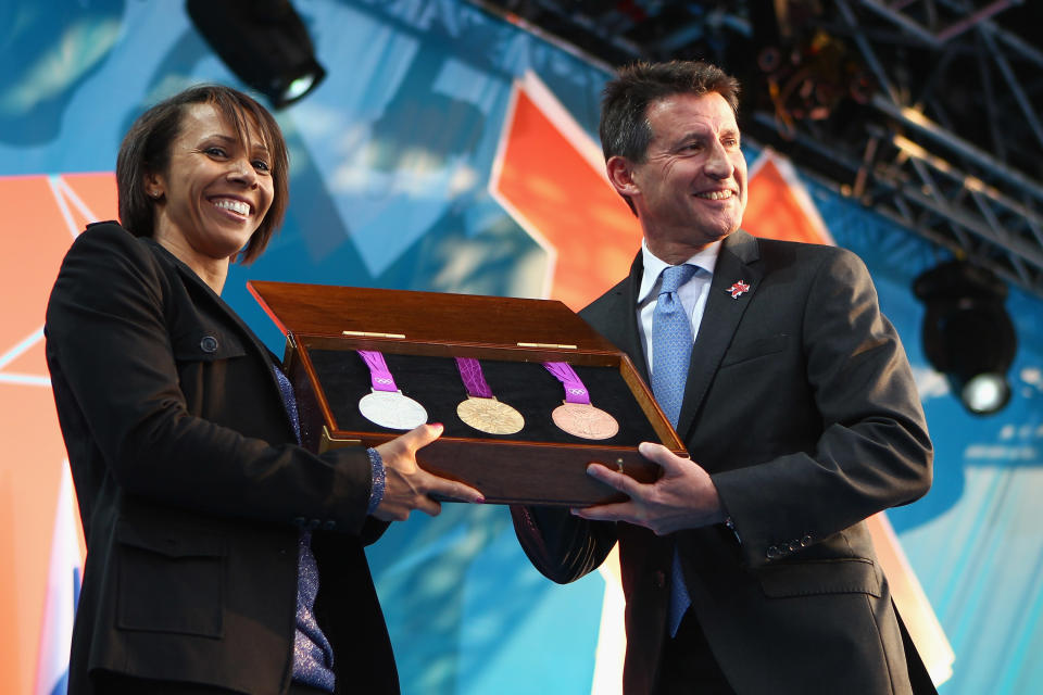 LONDON, ENGLAND - JULY 27: Dame Kelly Holmes and LOCOG Chairman Sebastian Coe present the olympic medals during the' London 2012 - One Year To Go' ceremony in Trafalgar Square on July 27, 2011 in London, England. The one year countdown to the London 2012 Olympic games was marked with a unique ceremony in Trafalgar Square, with IOC President Jacques Rogge inviting the world's athletes to compete in next summer's games. (Photo by Clive Mason/Getty Images)