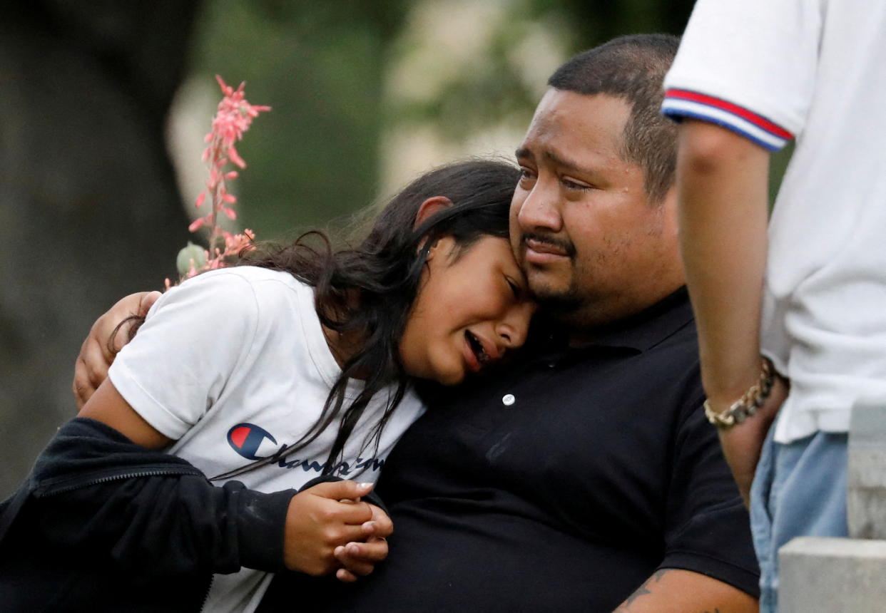 People grieve outside the Willie de Leon Civic Center