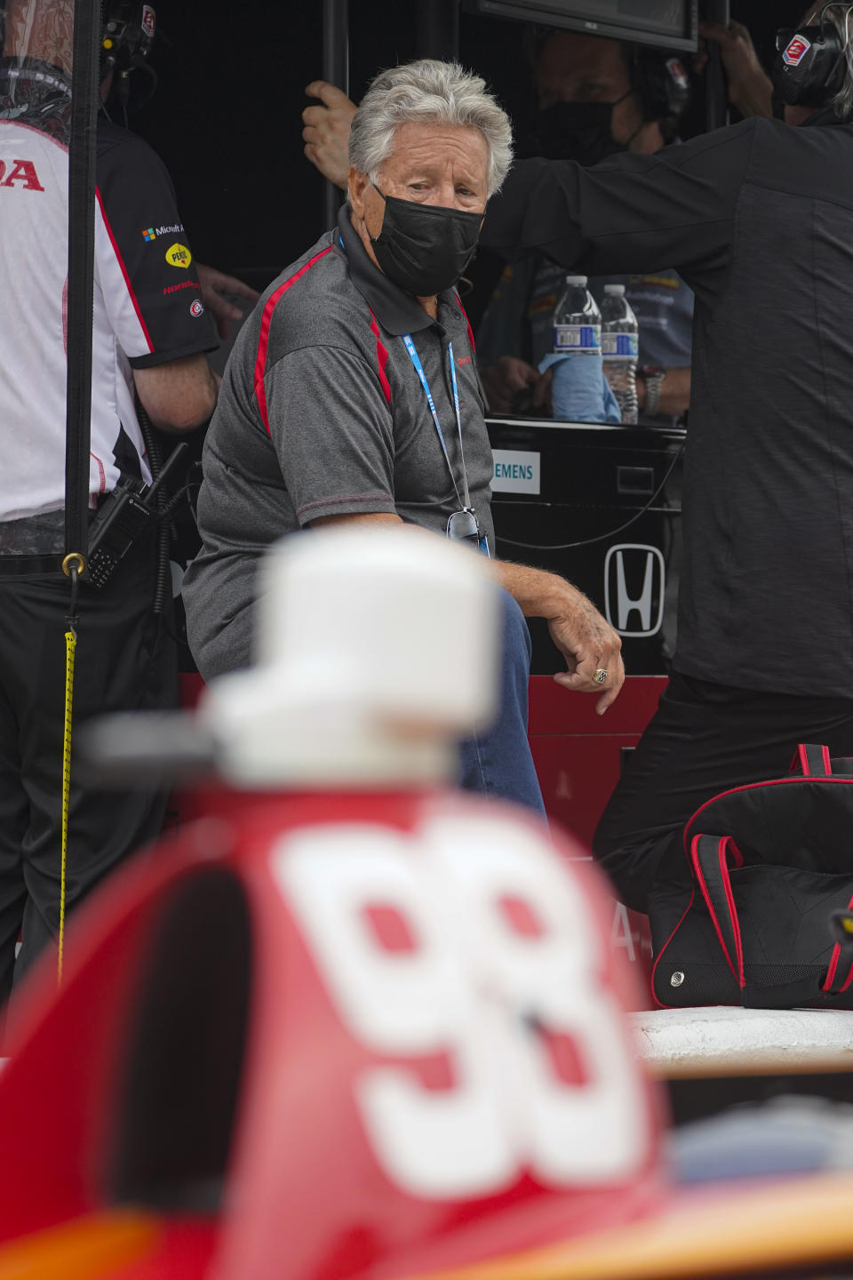 Mario Andretti watches as his grandson Marco Andretti practices for the Indianapolis 500 auto race at Indianapolis Motor Speedway in Indianapolis, Tuesday, May 18, 2021. (AP Photo/Michael Conroy)