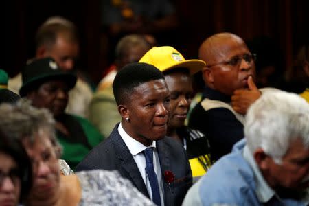 Victor Mlotshwa sits in court as farmers Willem Oosthuizen and Theo Martins face sentencing for kidnap, assault and attempted murder, in connection with forcing a Mlotshwa into a coffin, in Middelburg, South Africa, October 27, 2017. REUTERS/Siphiwe Sibeko