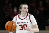 FILE -Oklahoma guard Taylor Robertson (30) moves the ball during the second half of an NCAA college basketball game against Baylor Wednesday, Jan. 12, 2022, in Norman, Okla. Taylor Robertson became the Division I leader in 3-pointers, Saturday, Jan. 28, 2023. (AP Photo/Garett Fisbeck, File)