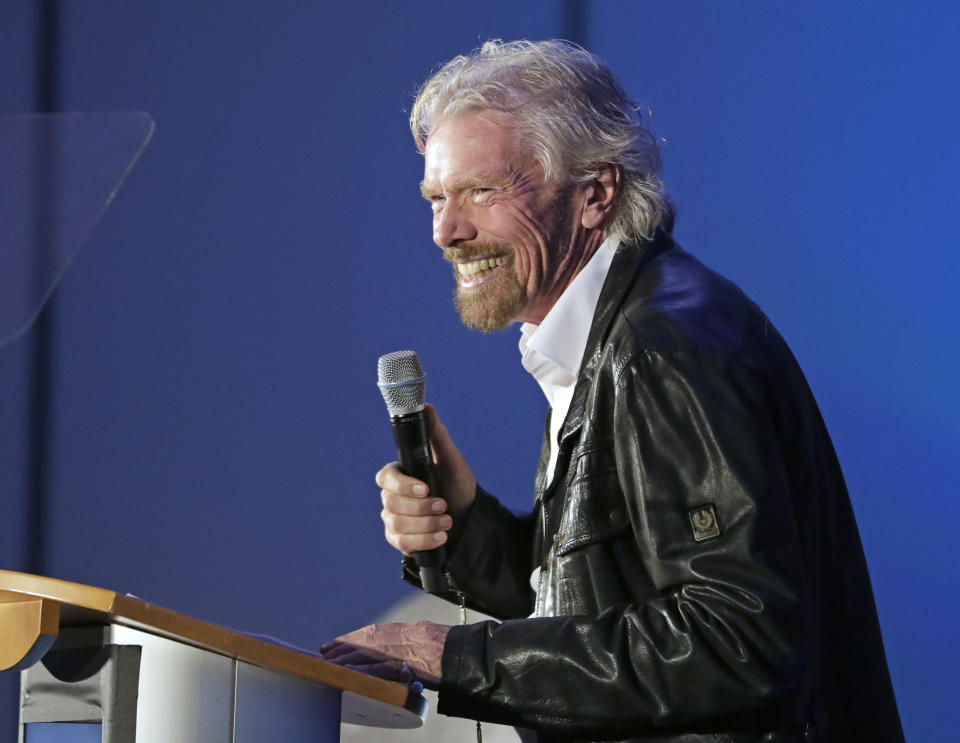 Richard Branson makes remarks during a luncheon attended by 100 Virgin Galactic ticket holders, to mark his 69th birthday and in recognition of the Apollo 11 moon landing anniversary at the Kennedy Space Center Visitor Complex, Thursday, July 18, 2019, in Cape Canaveral, Fla. (AP Photo/John Raoux)