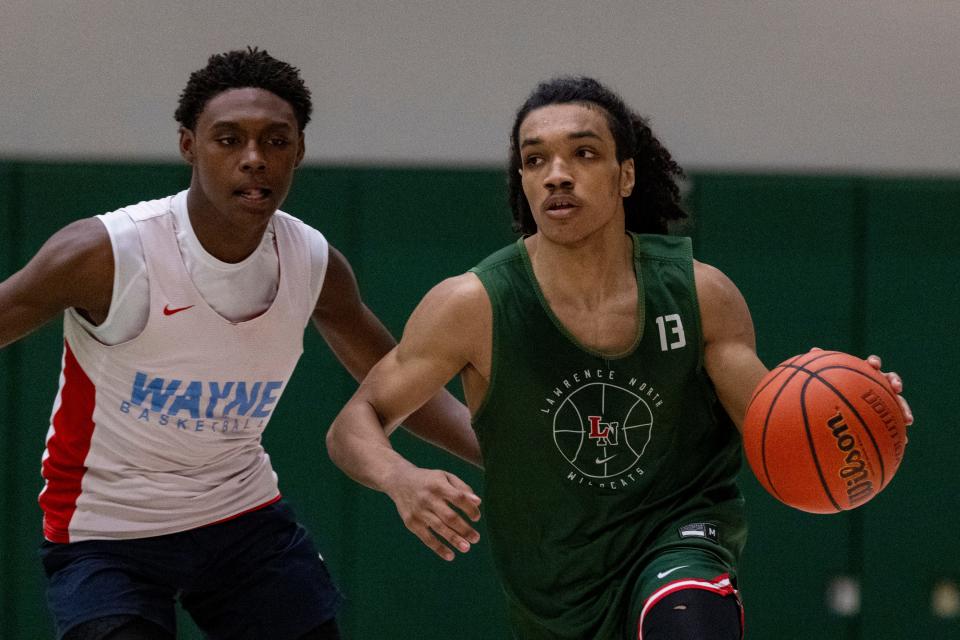 Lawrence North High School's Kobi Bowles (13) brings the ball up court during Charlie Hughes Shootout basketball action, Saturday, June 24, 2023, at Westfield High School.