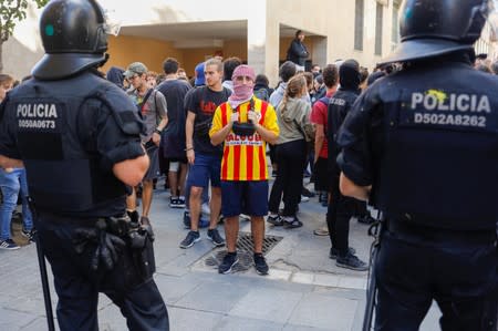 Protesters gather as Ciudadanos party leader Albert Rivera visits the Saudade centre in Barcelona