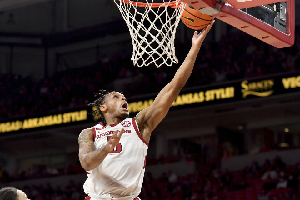 Arkansas guard Au'Diese Toney (5) makes a layup against Arkansas-Little Rock during the first half of an NCAA college basketball game Saturday, Dec. 4, 2021, in Fayetteville, Ark. (AP Photo/Michael Woods)