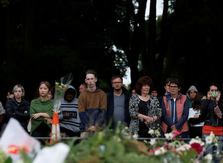 People pay their respects at a memorial site for victims of the mosque shootings in Christchurch, New Zealand, March 17, 2019. REUTERS/Jorge Silva