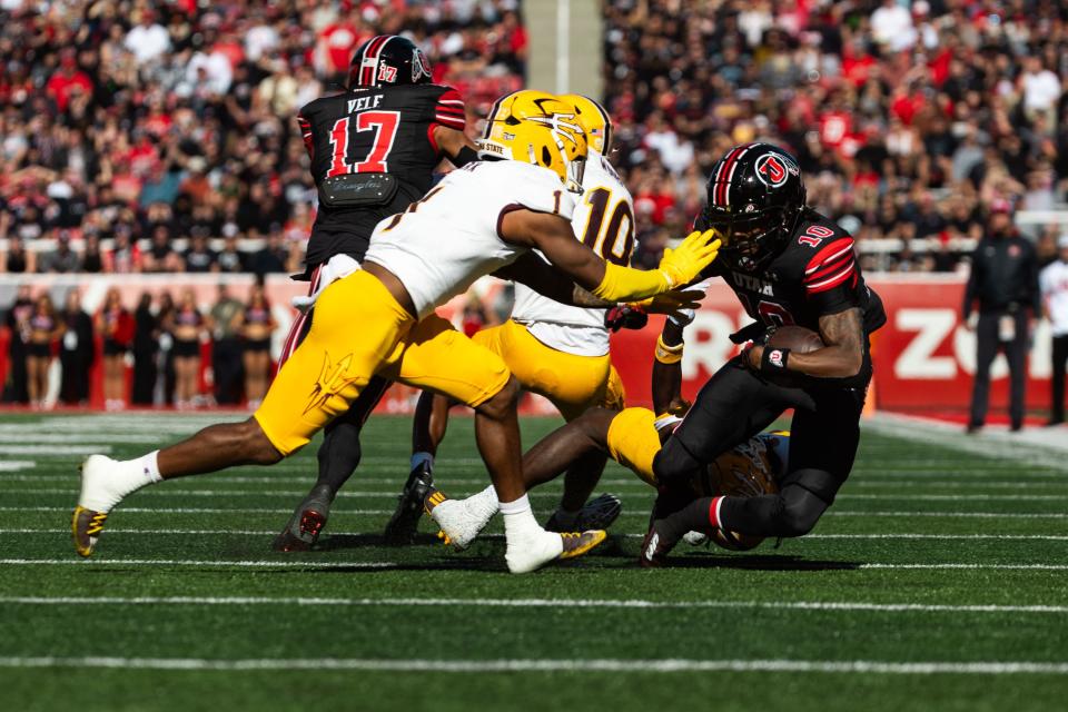 Utah Utes wide receiver Money Parks runs the ball with Arizona State Sun Devils defensive back Jordan Clark on defense during the game at Rice-Eccles Stadium in Salt Lake City on Saturday, Nov. 4, 2023. | Megan Nielsen, Deseret News