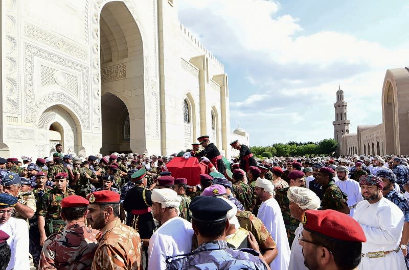 Mourners carry the coffin of late Sultan Qaboos bin Said during the funeral in Muscat