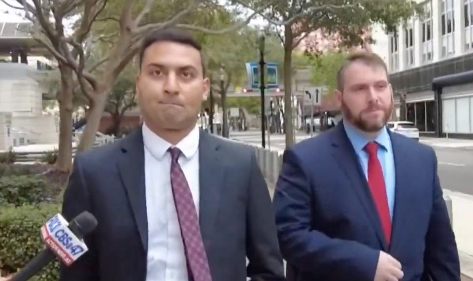 Fired Jacksonville Jaguars employee Amit Patel, left, and attorney Alex King exit the federal courthouse after pleading guilty to defrauding the team of about $22 million.
