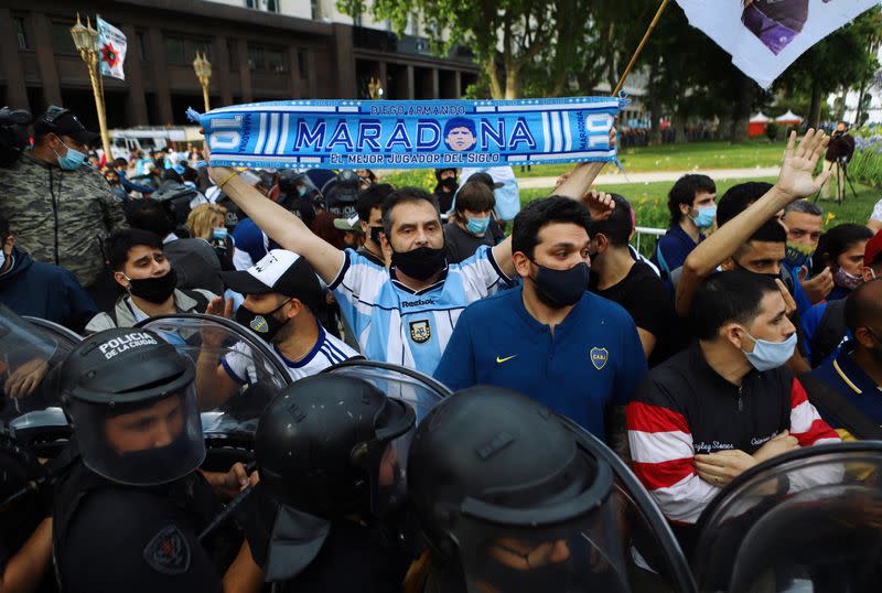 People line up for the wake of soccer legend Diego Maradona at the presidential palace Casa Rosada, in Buenos Aires