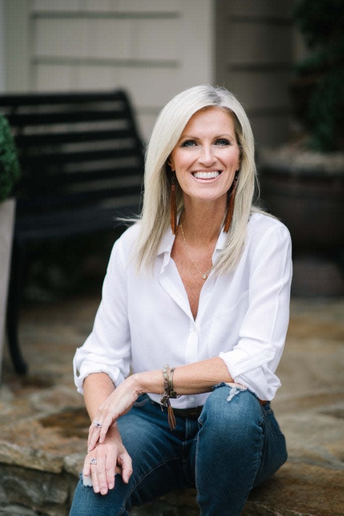 Hardin Valley resident Kim Frazier flashes her thousand-watt smile outside her home while running for Knox County Commission At-large seat 11. She hopes to unite communities. Photo by Tracie Guidry Ancelet