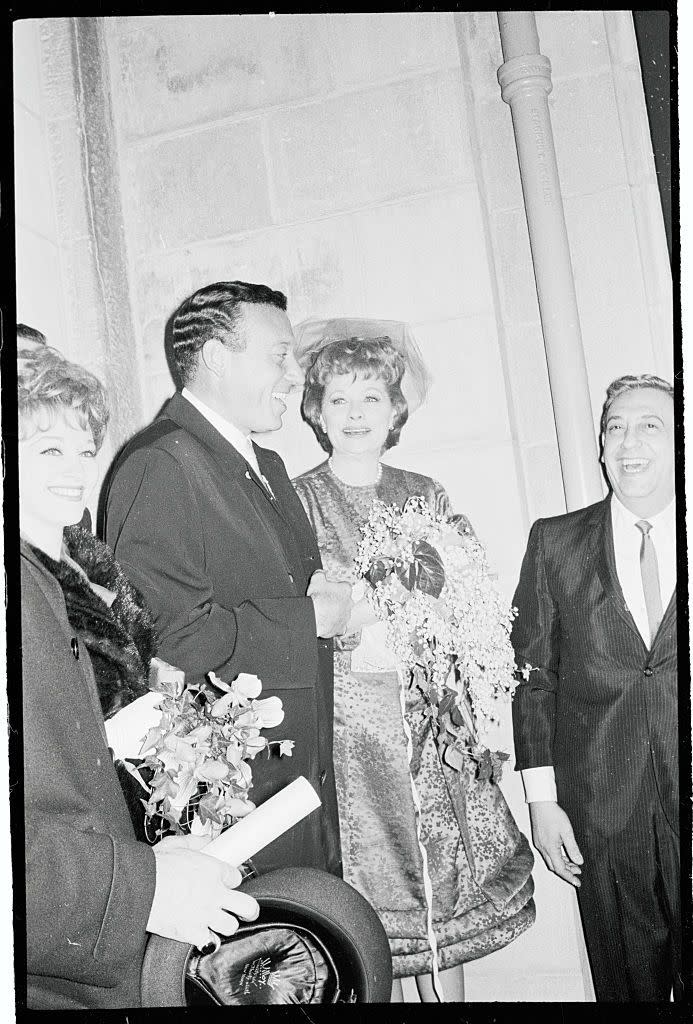 1961: Greeting guests outside of her and Gary Morton's wedding ceremony