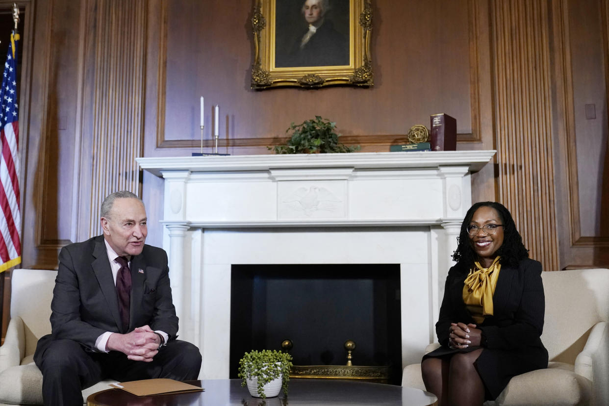 Senate Majority Leader Chuck Schumer of N.Y., left, sits down for a meeting with Supreme Court nominee Ketanji Brown Jackson, right, on Capitol Hill in Washington, Wednesday, March 2, 2022. (AP Photo/Susan Walsh)