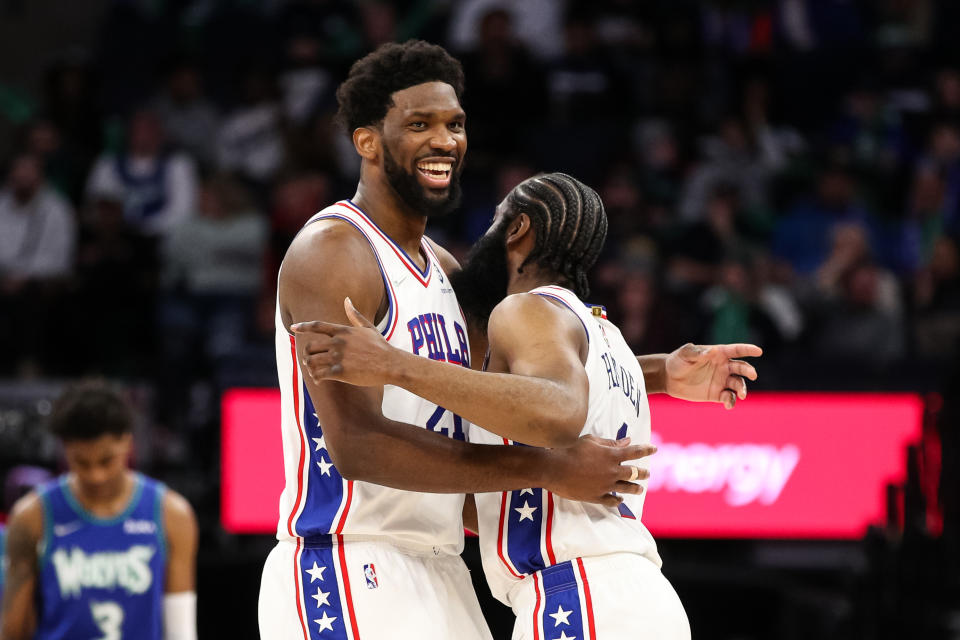 Joel Embiid and James Harden of the Philadelphia 76ers celebrate after Harden drew a foul in the fourth quarter of a game on Feb, 25. (David Berding/Getty Images)