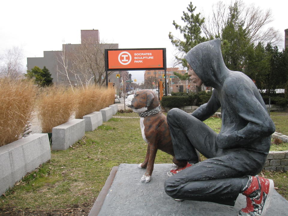 This March 6, 2013 photo shows "Raymond & Toby," a 1994 sculpture by John Ahearn at Socrates Sculpture Park in the Astoria section of the Queens borough of New York. The waterfront park is one of several art-related attractions in Astoria and the adjacent neighborhood of Long Island City. A boom in moderately priced hotels in Long Island City has begun luring tourists to the area. Along with museums, parks, hotels and ethnic restaurants, the area is still home to a large industrial base, from auto shops to factories. (AP Photo/Beth J. Harpaz)