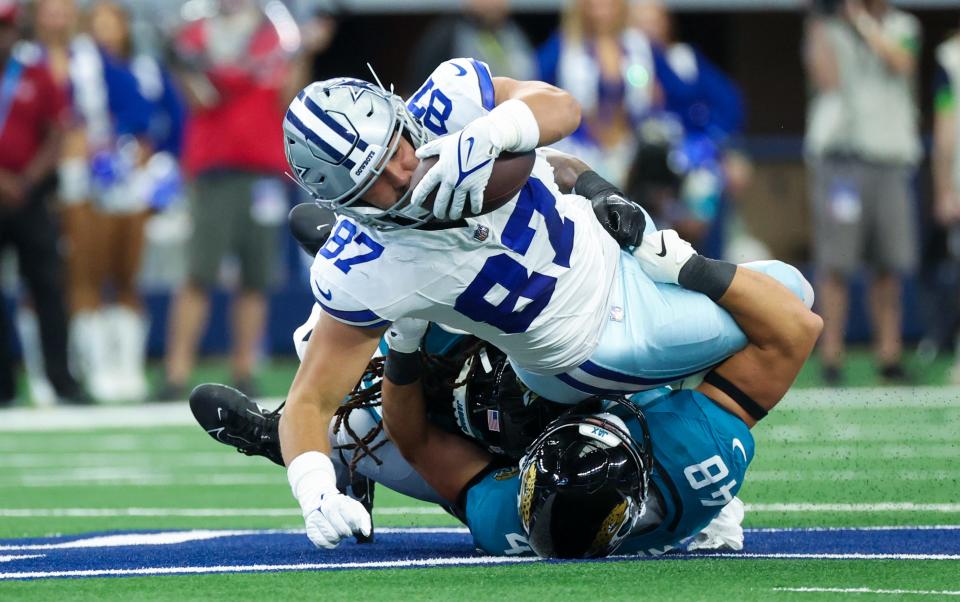 Dallas Cowboys tight end Jake Ferguson (87) tries for extra yardage against Jacksonville on Aug. 12, 2023.