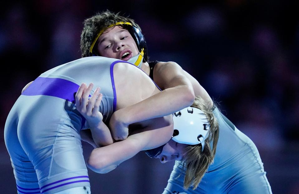 Avon Nathan Rioux wrestles Brownsburg Revin Dickman in the 108 weight-class finals during the IHSAA Wrestling State Finals Saturday, Feb.19, 2023 at Gainbridge Fieldhouse in Indianapolis. 