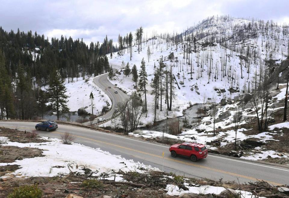 Traffic heads downhill along Highway 168 towards Shaver Lake between storms Friday afternoon, March 17, 2023.