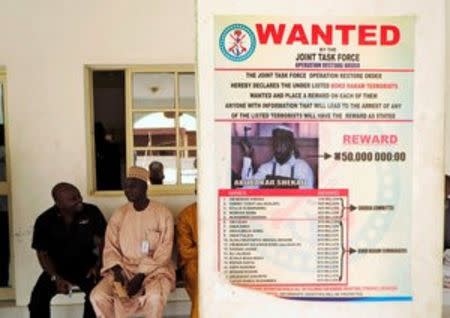 FILE PHOTO - A poster advertising for the search of Boko Haram leader Abubakar Shekau is pasted on a wall in Baga village on the outskirts of Maiduguri, in the north-eastern state of Borno, Nigeria May 13, 2013. REUTERS/Tim Cocks/File Photo