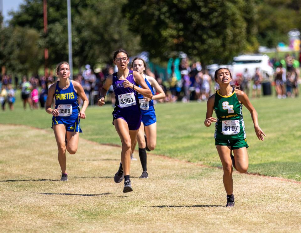 Springlake-Earth’s Aabriella Villanueva (right) competes in the Lubbock Independent School District cross country Invitational, Saturday, Sept. 17, 2022, at Mae Simmons Park.