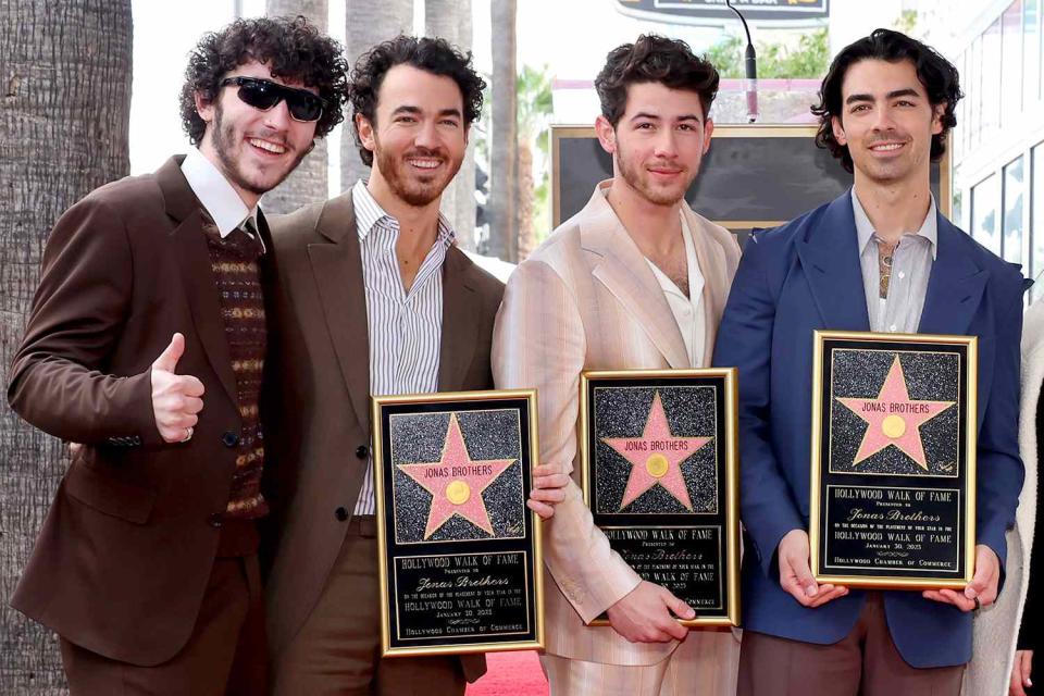 <p>Amy Sussman/Getty Images</p> The Jonas Brothers and brother Frankie Jonas (L) on Jan. 30, 2023, in Hollywood, California