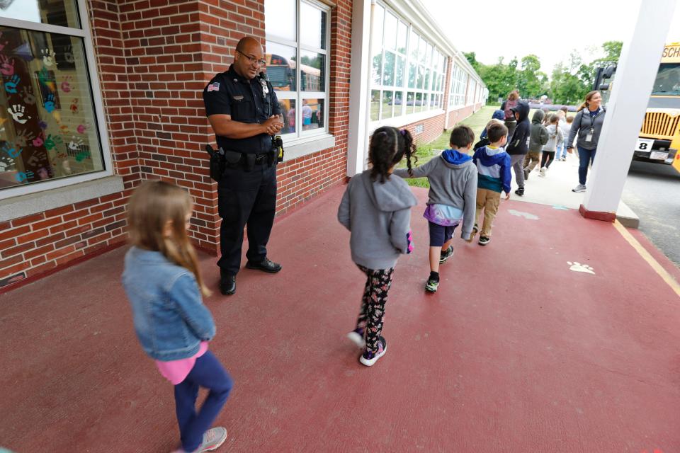 Westport police officer Fernando Goncalves at the Alice Macomber school on Gifford Road in Westport.