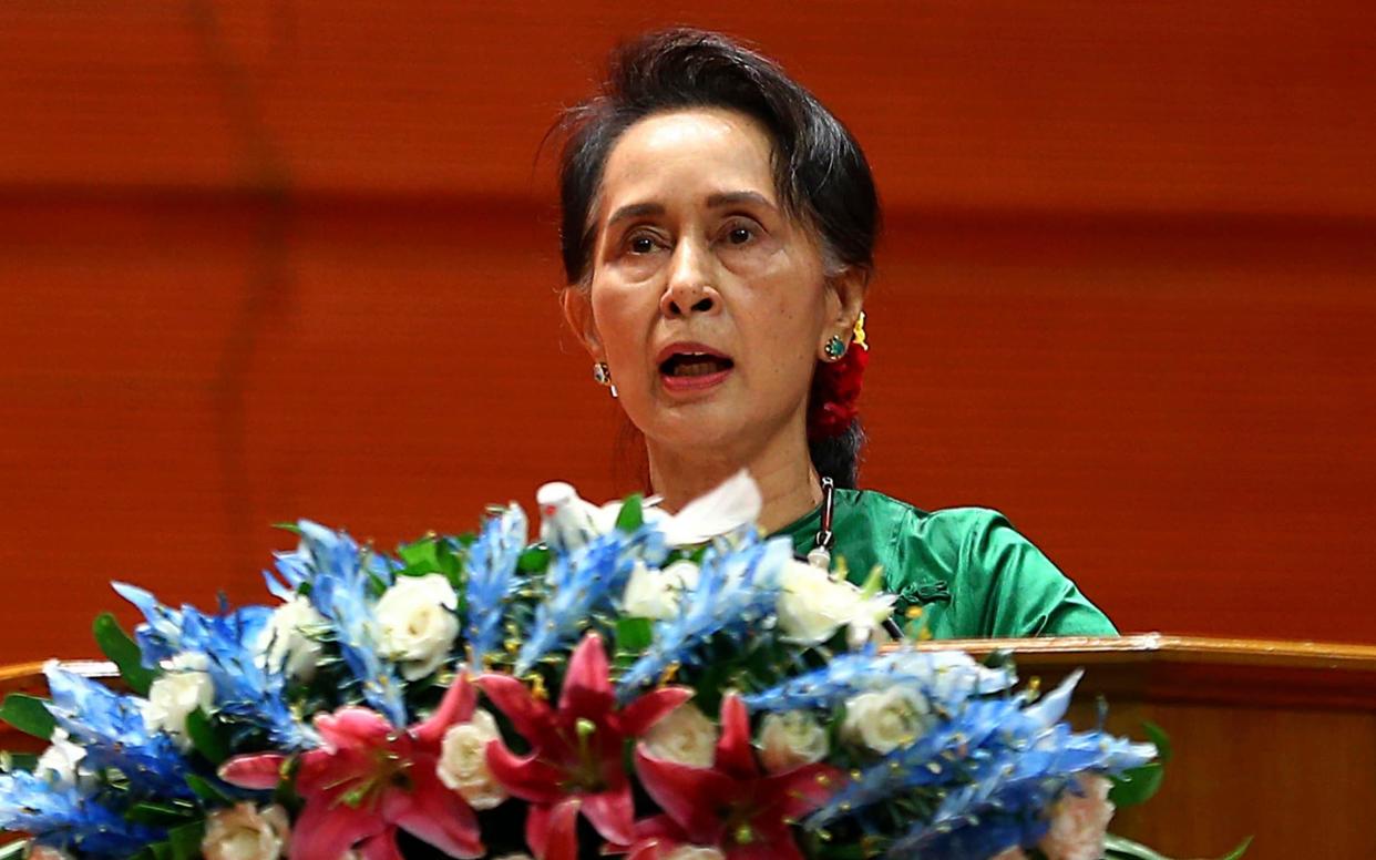 Burmese leader Aung San Suu Kyi's government as failed to deliver justice for farmers whose land was confiscated over decades by the army, a new report claims - AP