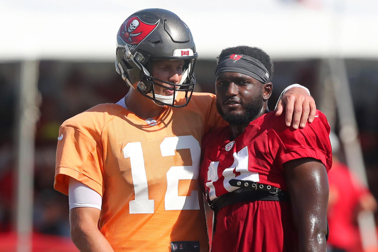 TAMPA, FL - AUG 18: Tom Brady (12) of the Buccaneers wraps his arm around Chris Godwin (14) during the Tennessee Titans &  Tampa Bay Buccaneers joint training camp on August 18, 2021 at the AdventHealth Training Center at One Buccaneer Place in Tampa, Florida. (Photo by Cliff Welch/Icon Sportswire via Getty Images)