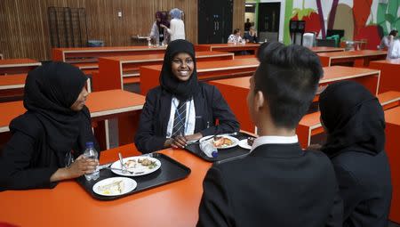 Pupils are seen eating lunch at Waverley School in Birmingham, Britain, June 26, 2015. Picture taken June 26, 2015. REUTERS/Andrew Yates