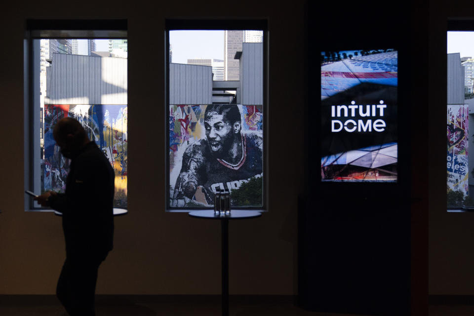 A mural depicting Los Angeles Clippers' Kawhi Leonard is seen through a window of a model room of Intuit Dome, a proposed arena for the Clippers located in Inglewood, Calif., Thursday, Sept. 16, 2021, in Los Angeles. (AP Photo/Jae C. Hong)